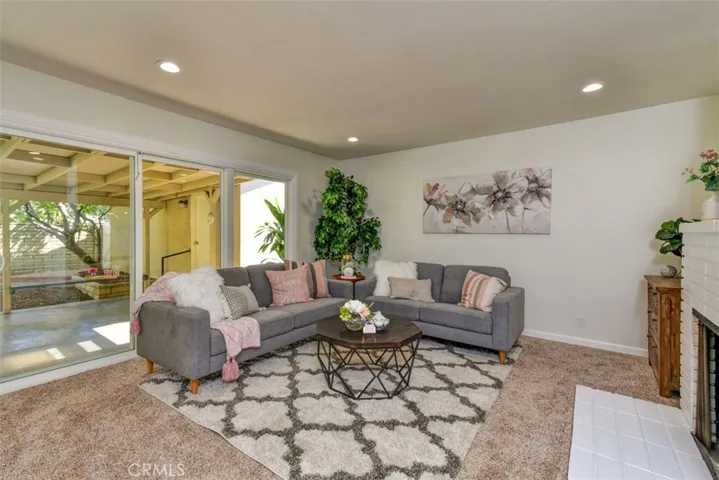 Another view of living room.  Entrance to the 2-car garage is within view.