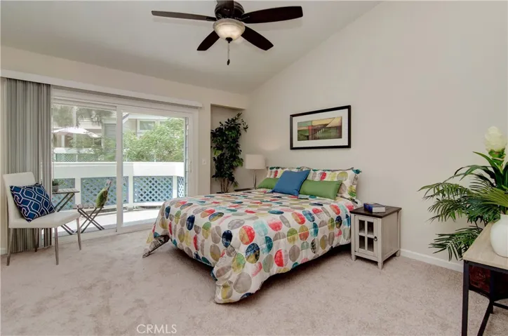 Tall ceilings and a slider out to your deck from this large master bedroom.