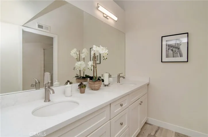 Master bathroom with brand new dual vanity, new flooring, paint, fixtures and hardware.
