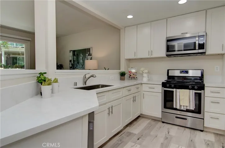 Quartz counters, white shaker cabinetry, recessed lighting, stainless steel appliances. This kitchen is ready to go!