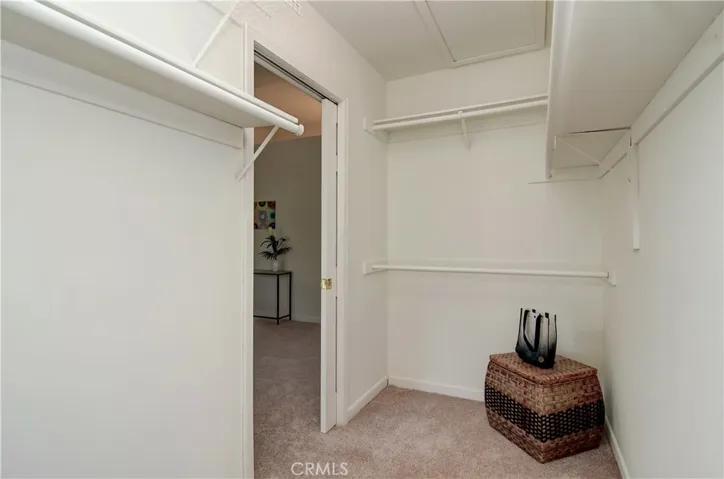 Beyond the pocket door awaits a large walk-in closet!