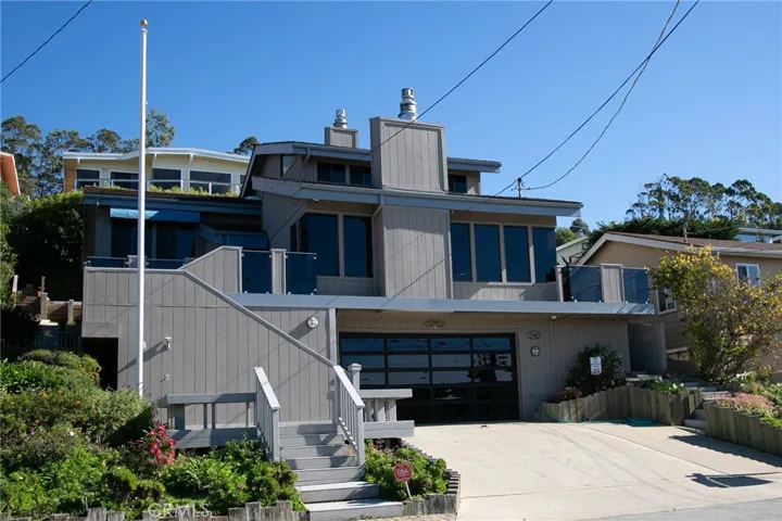 This home was custom built in 1979 but has had numerous upgrades including glassed in decks, custom glass garage door, 50 am electric for hook up to your RV, concrete shake roof, remodeled kitchen, remote controlled fireplaces, hand scraped flooring and astro turf in the rear yard. With 5 bedrooms and a den, it is the ultimate family/vacation home.