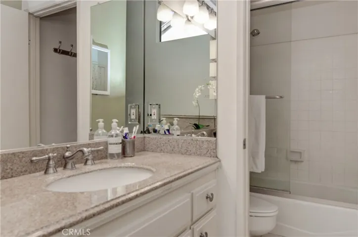 Solid surfcae vanity keeps clean up easy in the dressing area. Separate bathing and commode area.