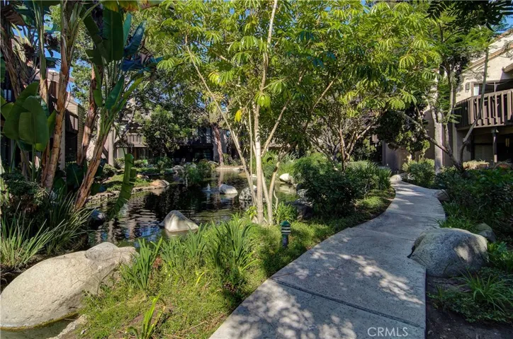 Tree studded grounds and meandering walkways, so serene. What a way to live! Let's tour the home....