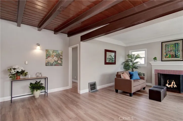 Open floor plan has great flow between rooms and lots of natural light. New wood grain vinyl plank flooring is easy to maintain.