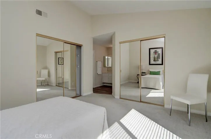 Two wardrobe closets in this second master suite.