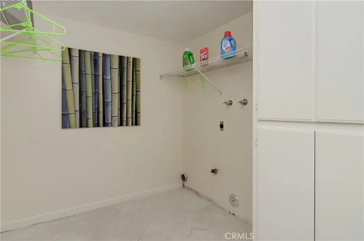 Fantastic utility room has so much room for laundry, storage and crafts.