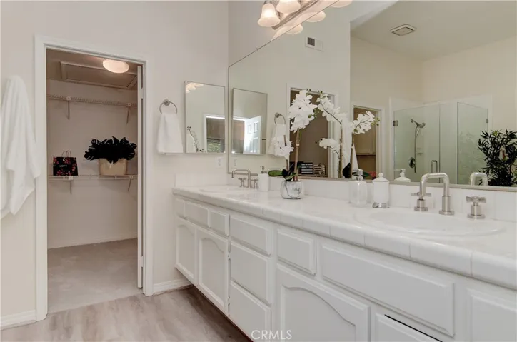 Main master bath has loads of vanity and counter space...plus huge walk-in closet.