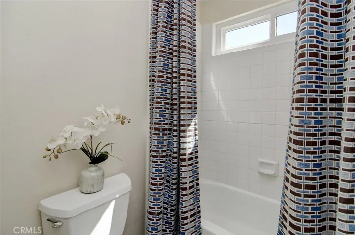 Separate commode and tub area in second master suite.