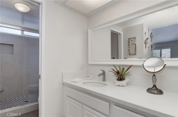 Master bath with quartz counter in vanity area.