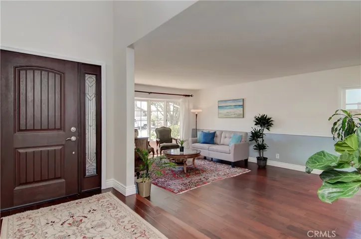 Raised entry with custom front door and sidelight.