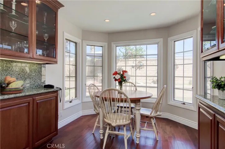 Breakfast nook boasts bay window and extra built-in storage, display and counter space.