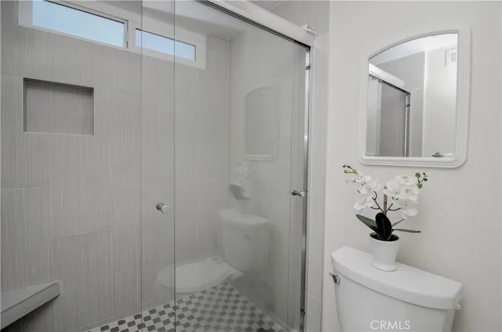 Large master shower with designer details.