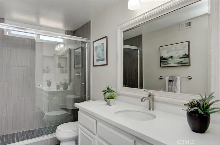 The family will love this large shower in the upstairs hall bathroom.
