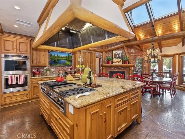Kitchen is appointed with dual ovens, dual dishwashers, dual sinks and built-in sub-zero refrigerator
