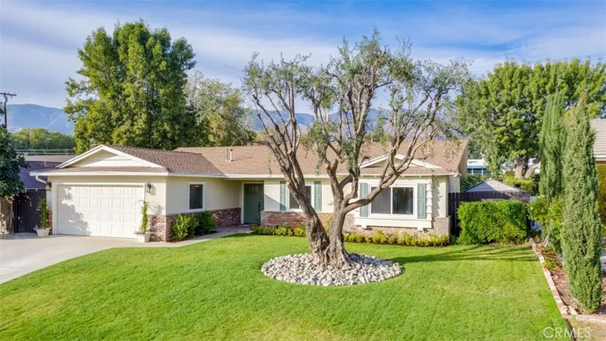 Welcome home ... expanded driveway and possibilities of RV parking
