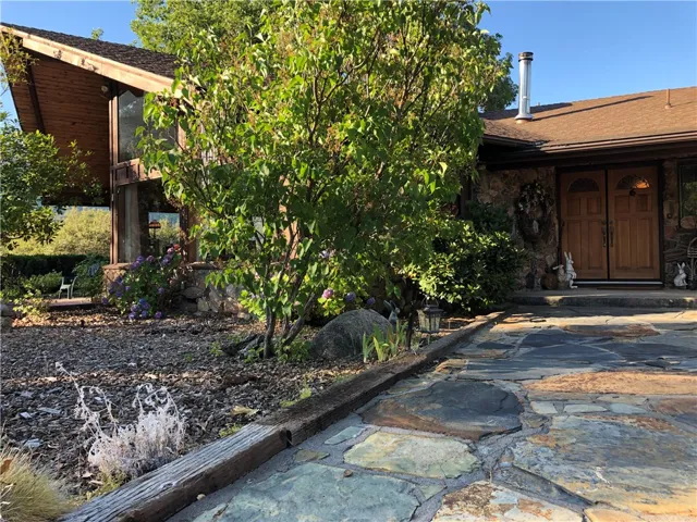 Beautiful slate rock walkway, mature landscaping.