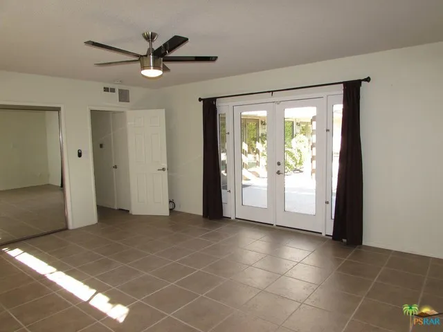 Master bedroom with french doors to back