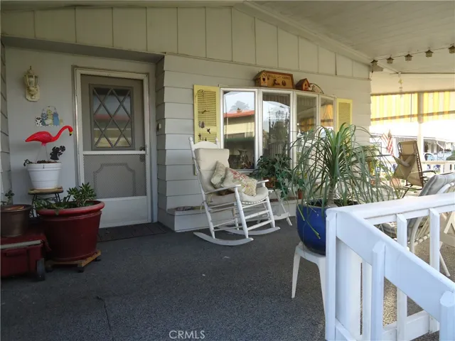 Part of the beautiful wrap around porch that faces the lakeside and golf course side