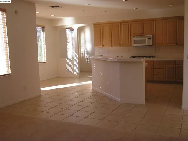 Large chefs kitchen with breakfast nook and breakfast bar.