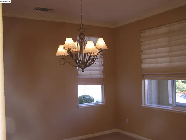 This formal dining room is large enough for entertaining with attached butlers pantry.