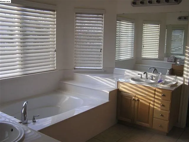Large soaking Tub with His & Her vanity.