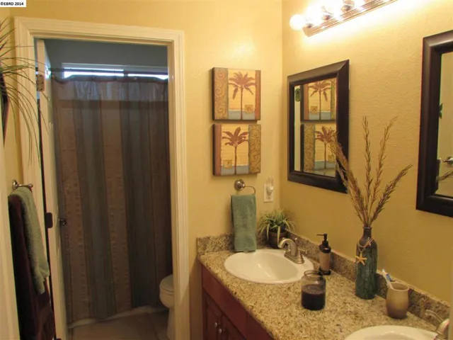 Upgraded with granite counters, tile flooring, double sinks