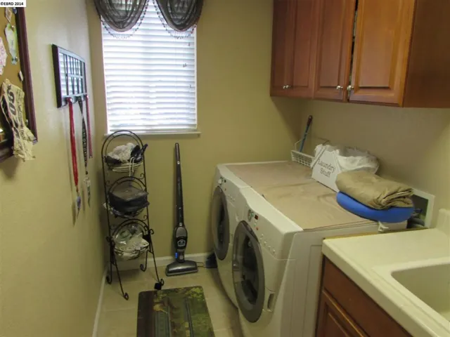 Has sink, cabinets for additional storage and room for a large refrigerator!