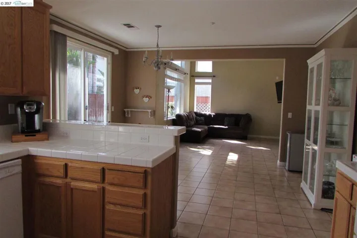 Taken from the kitchen, showing the family room and eat-in-kitchen.