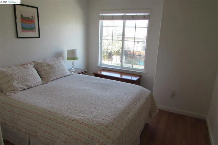 Lots of natural lighting. Neutral paint, laminate floor.