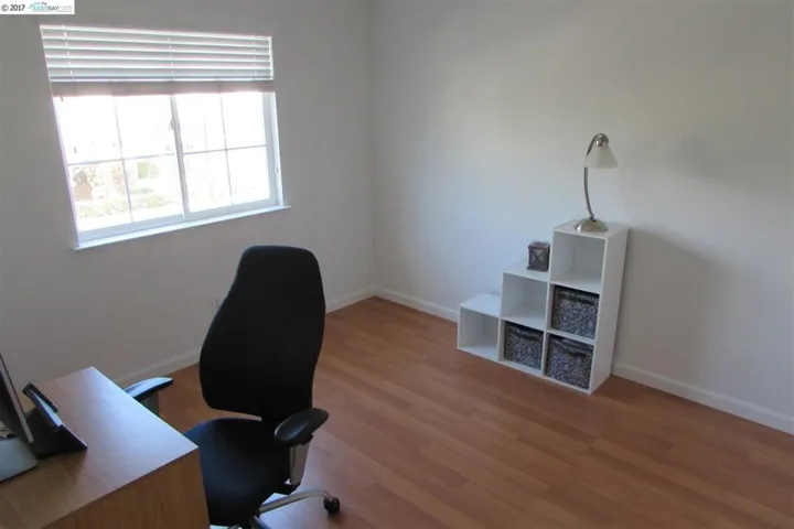 Neutral paint, laminate floor.