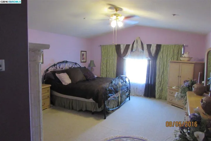 Large Master Bedroom overlooks the pool and has tons of natural light.