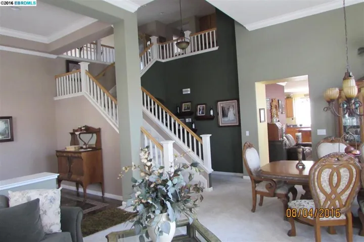 Staircase and hall leads to a full bath, large bedroom and sitting room that can be the 5th bedroom.