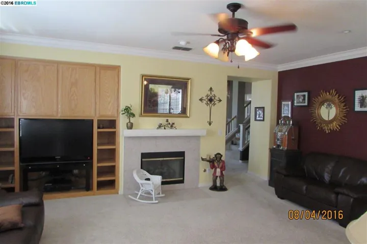 Generous sized family room has built-in cabinets, cozy fireplace. Kitchen/Family combo.