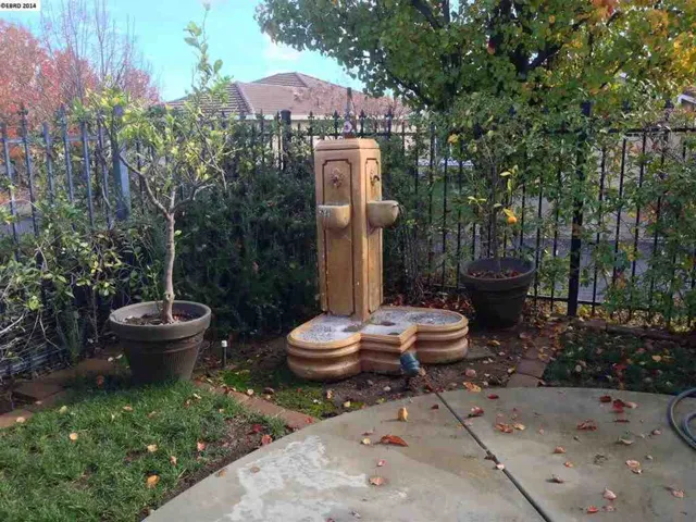 Relax in your peaceful backyard to the sounds of gently falling water.