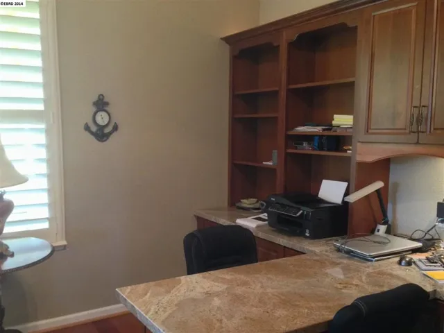 Partner Desk and Built in Cabinets provide plenty of storage and work space.