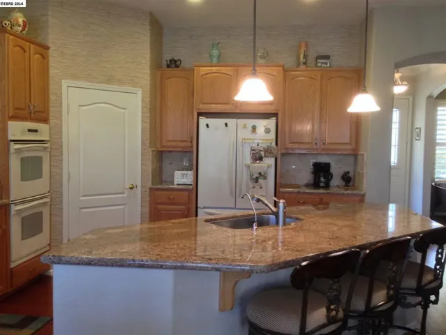 Granite Counters, Custom Cabinets and high end finishes complete this kitchen of your dreams.
