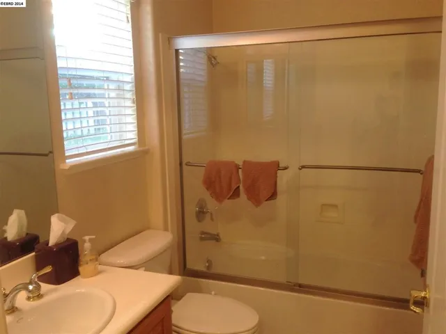 Generously sized full bathroom. Enclosed Shower over tub. Accessible from the Jr. Master Bedroom.
