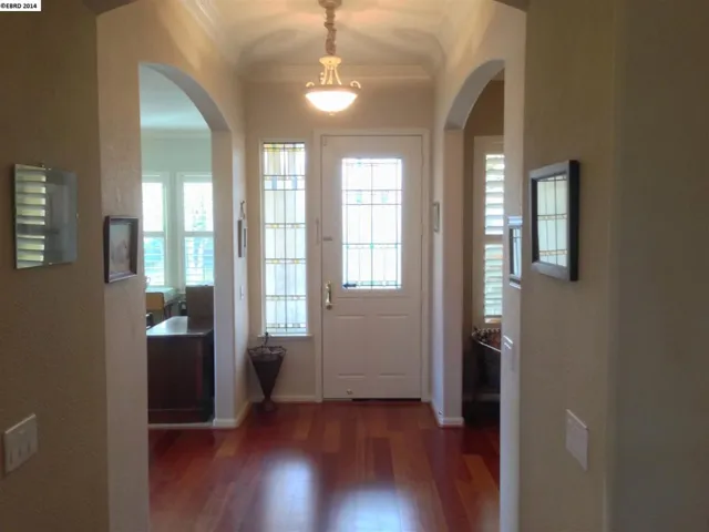High ceilings, crown moulding and arched doorways enhance the architecture.