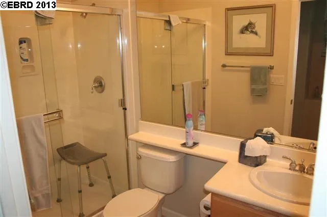 Full bath with stall shower located outside the office.