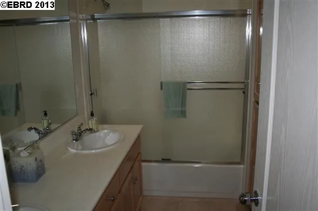 Main Bath has 2 sinks, tub over shower.