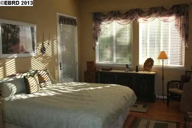 Lovely Master Bedroom has a French Door leading to Patio.