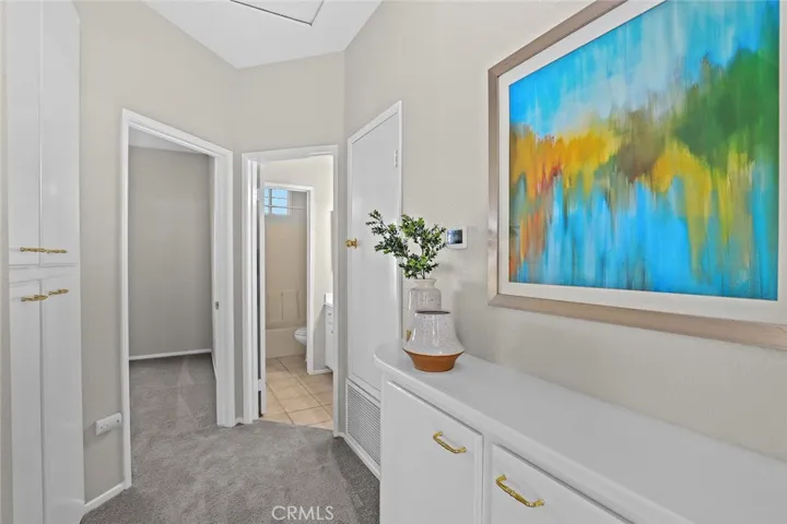 Upstair hallway with lots of storage cabinets