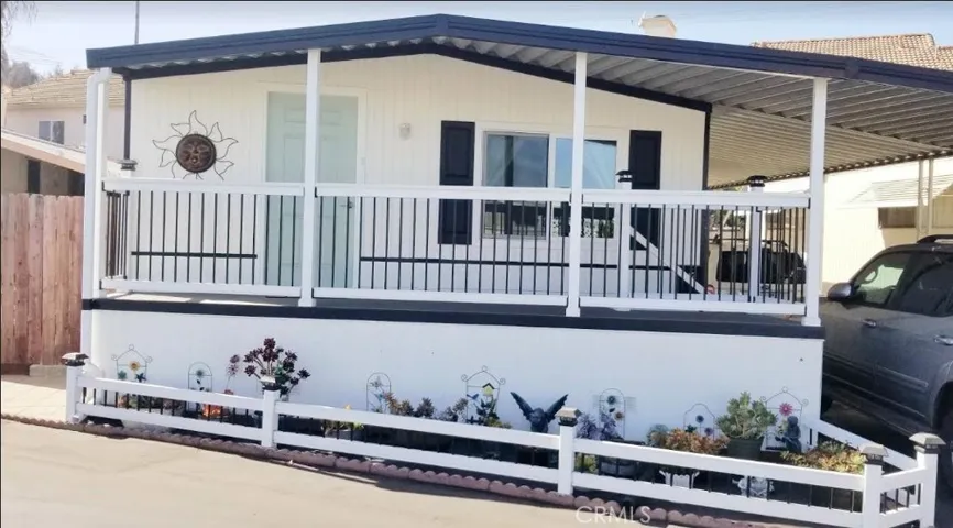 BEAUTIFUL HOME WITH LOVELY FRONT DECK TO ENJOY THE OUTDOORS