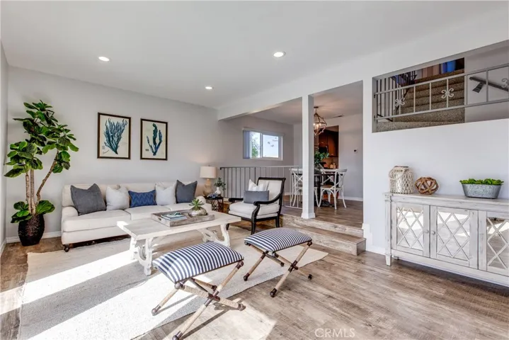 As you enter, high-end wood-finished flooring carries throughout.