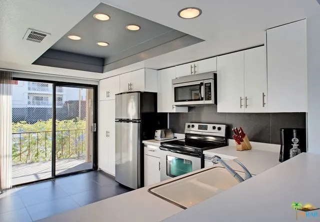 kitchen with balcony overlooking the poo