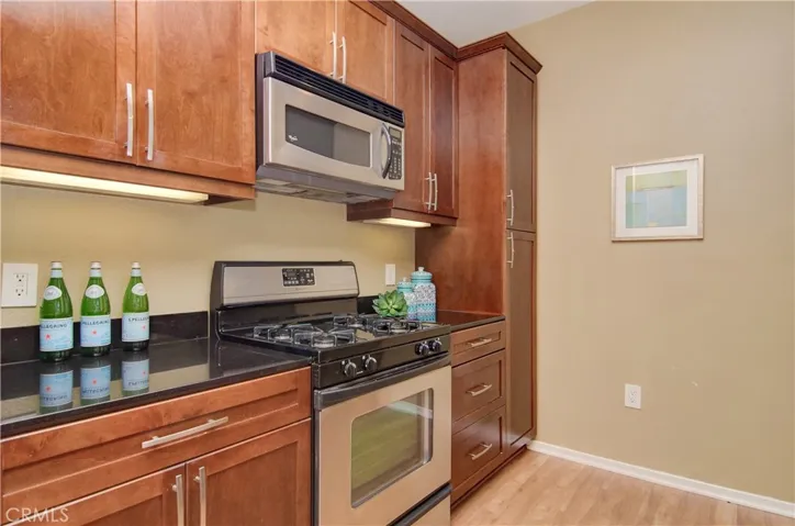 Floor to ceiling pantry adds even more storage options...plenty of prep space too!