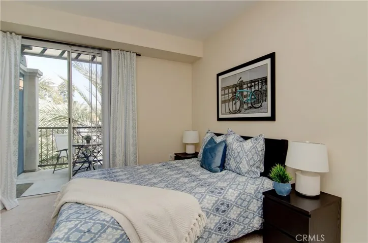 Enjoy tree views and terrace access from roomy master bedroom.