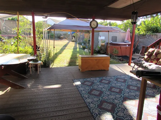Back Porch.  Bonus! No steps to get onto the back porch and to the back yard!