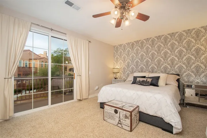 Large master bedroom with lots of light and room for a sitting area